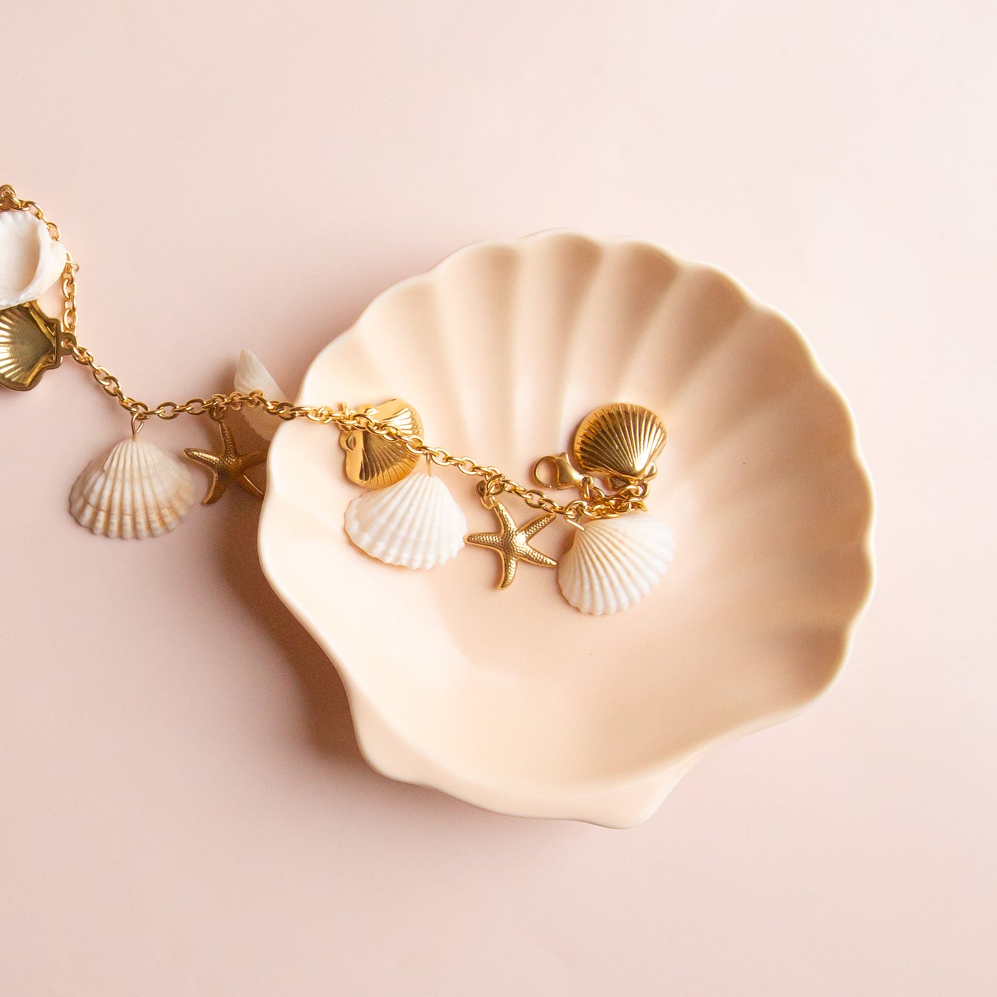 A seashell shaped ceramic trinket dish.