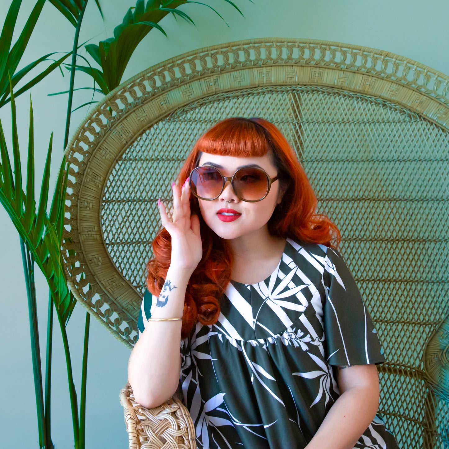 A cognac tortoise shaped round pair of sunglasses.