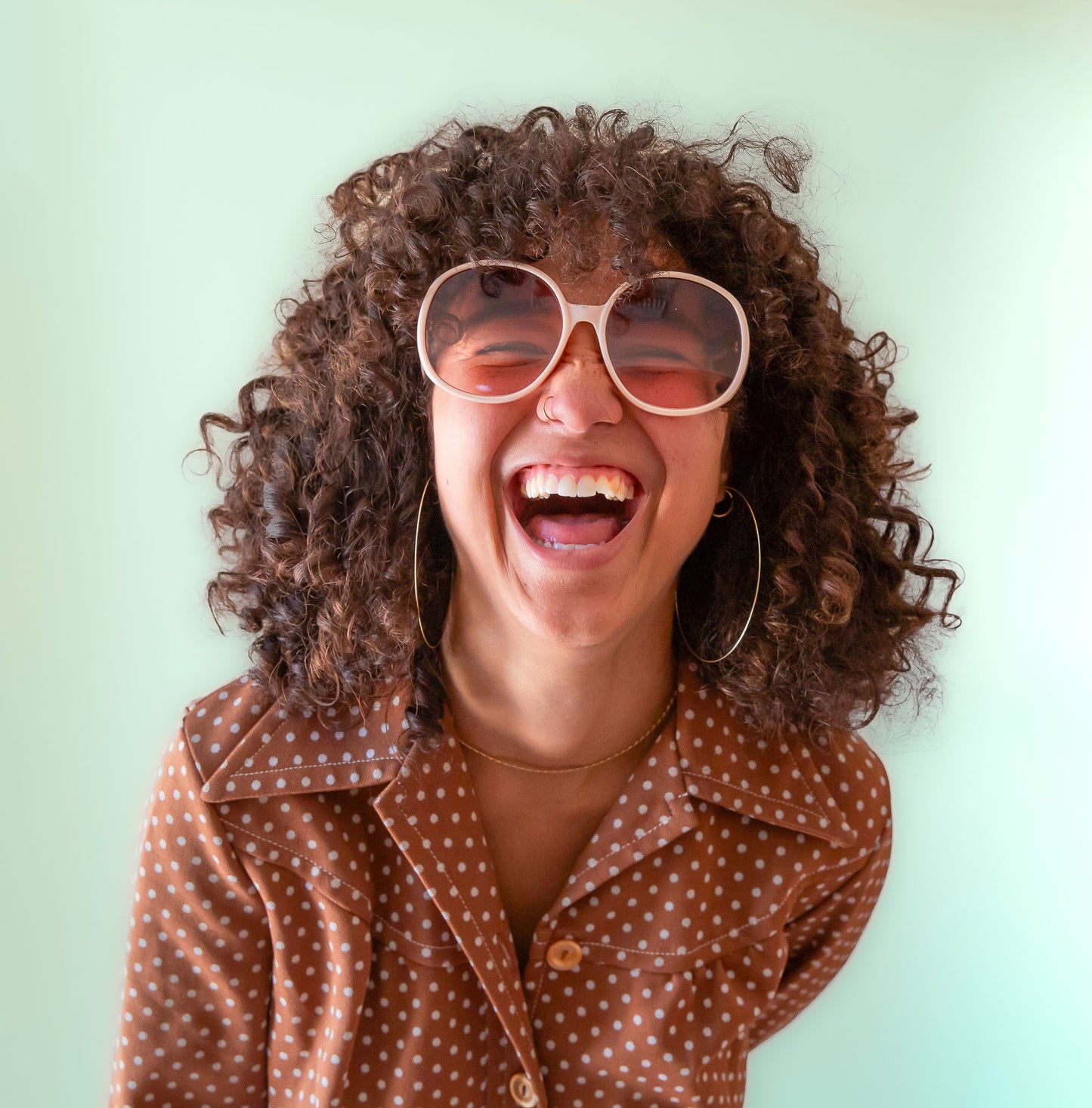 A pair of ivory round oversized sunglasses.