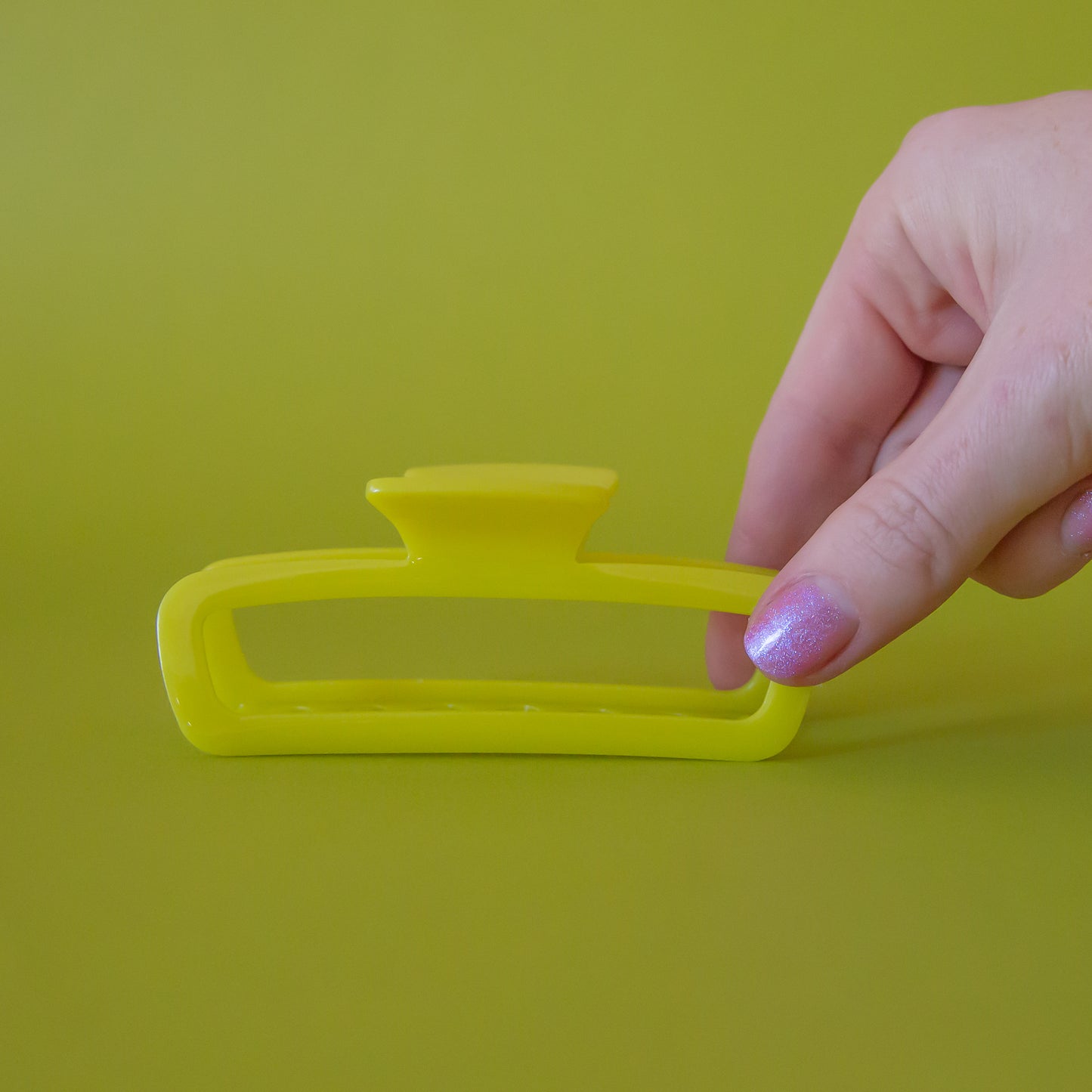 A yellow green hair claw clip.