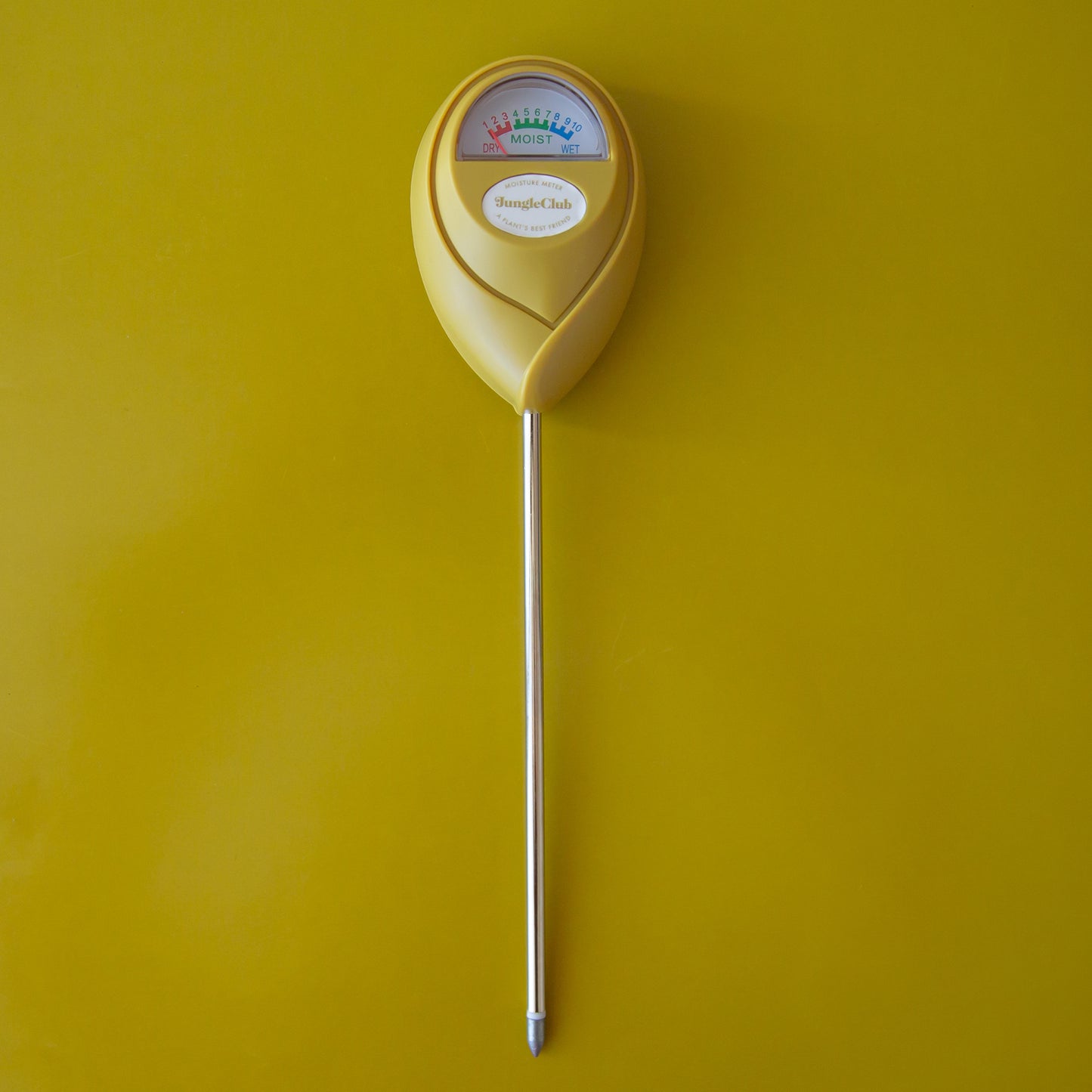 A chartreuse moisture meter with a rounded head and a white meter that ranges from dry, moist, or wet along with a small oval label in the front that reads, "Jungle Club".
