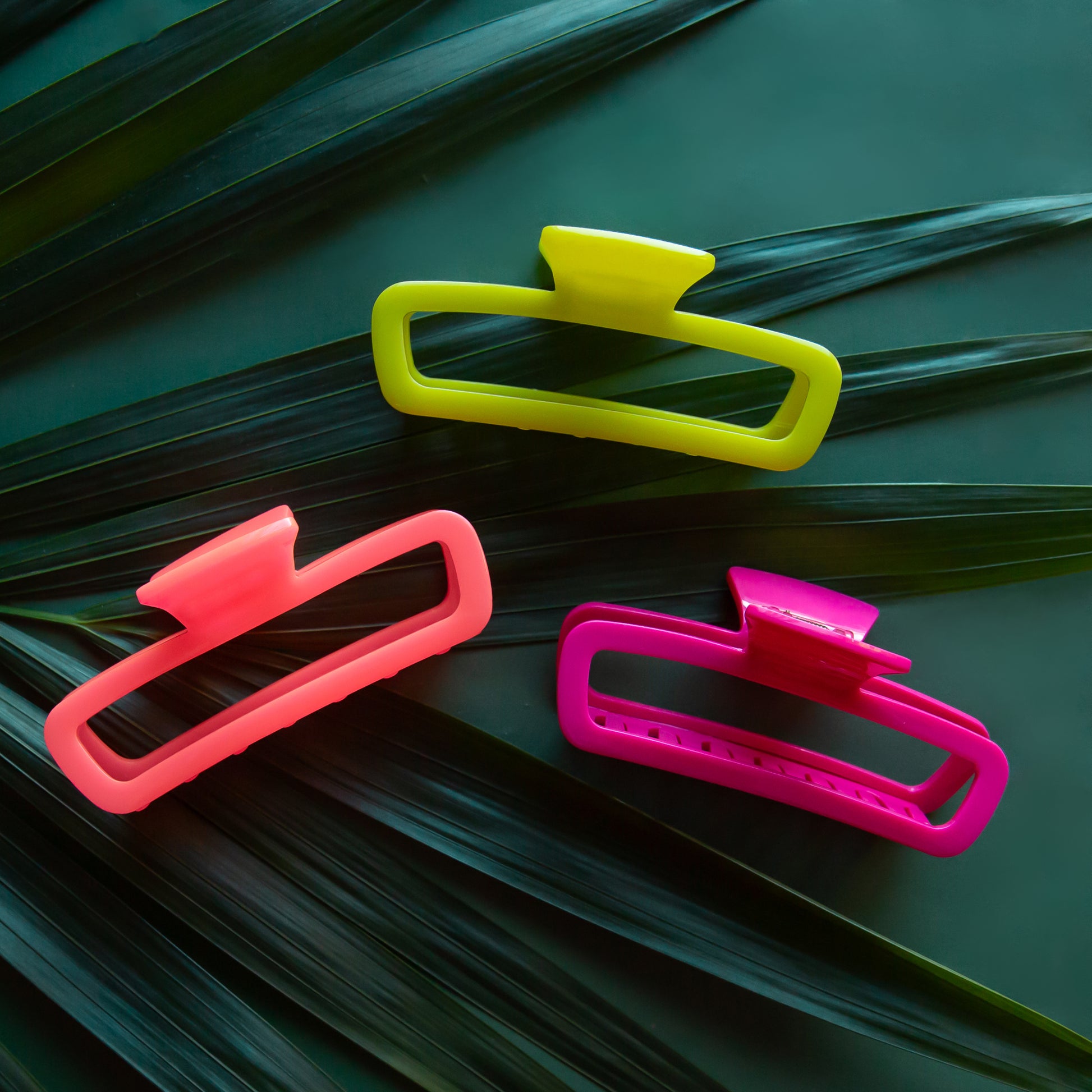 Three clips in hot pink, fuchsia and lime green. 