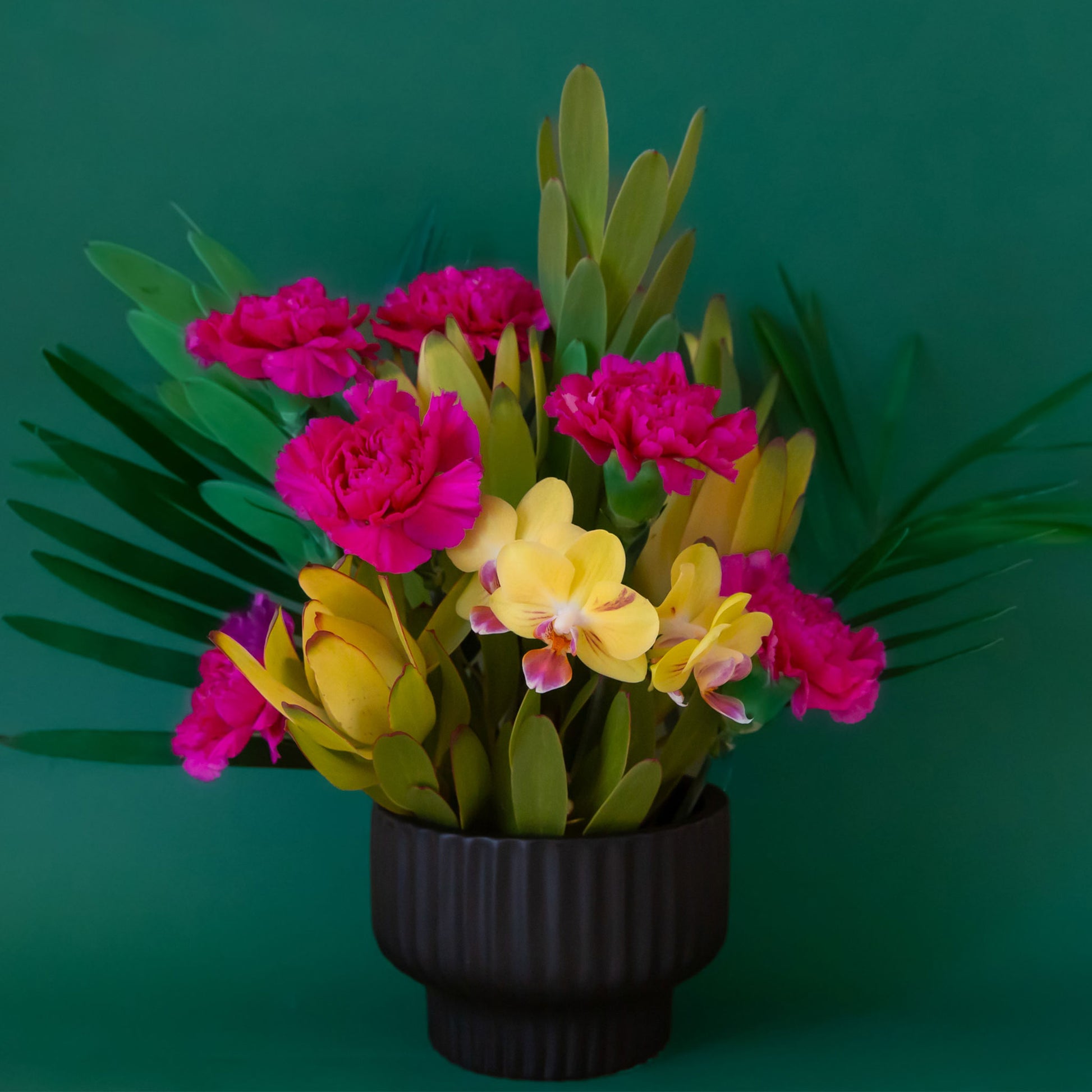 A ribbed black pedestal bowl planter. 