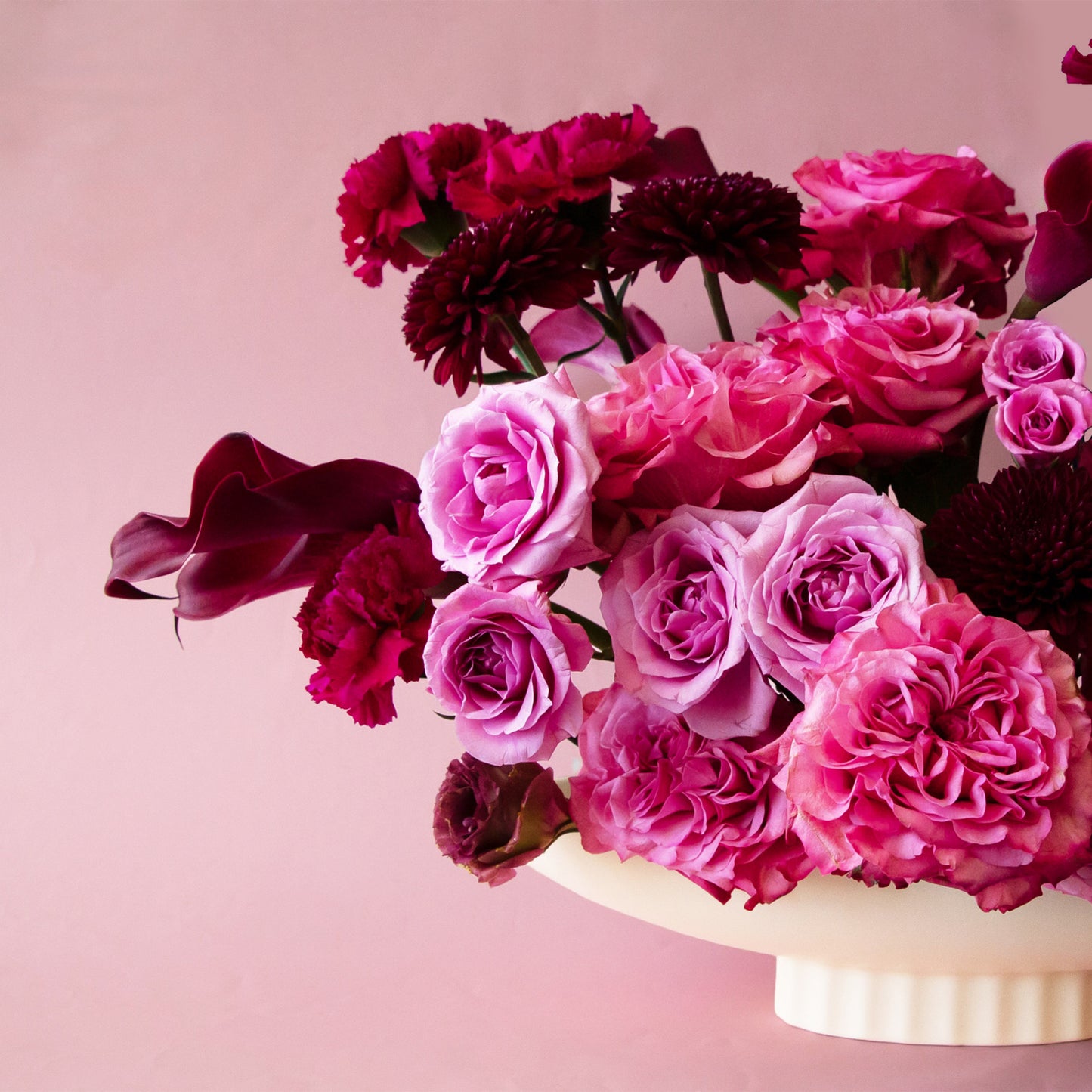 An elongated ceramic pedestal bowl 