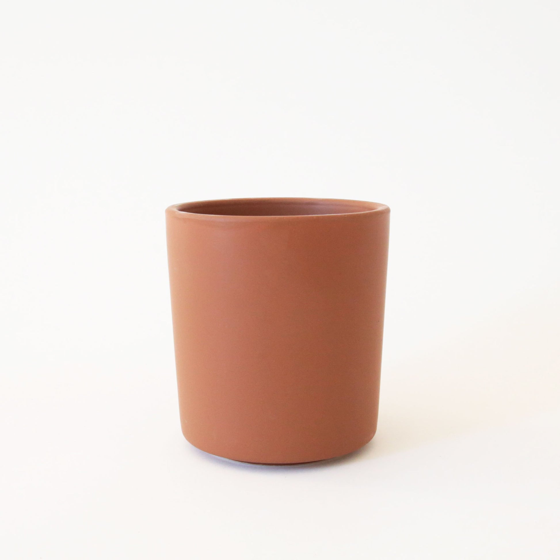 A mocha brown ceramic vase perfect for a succulent arrangement or a small plant.