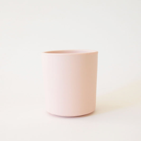 A light pink ceramic vase perfect for succulent arrangements or a small plant.