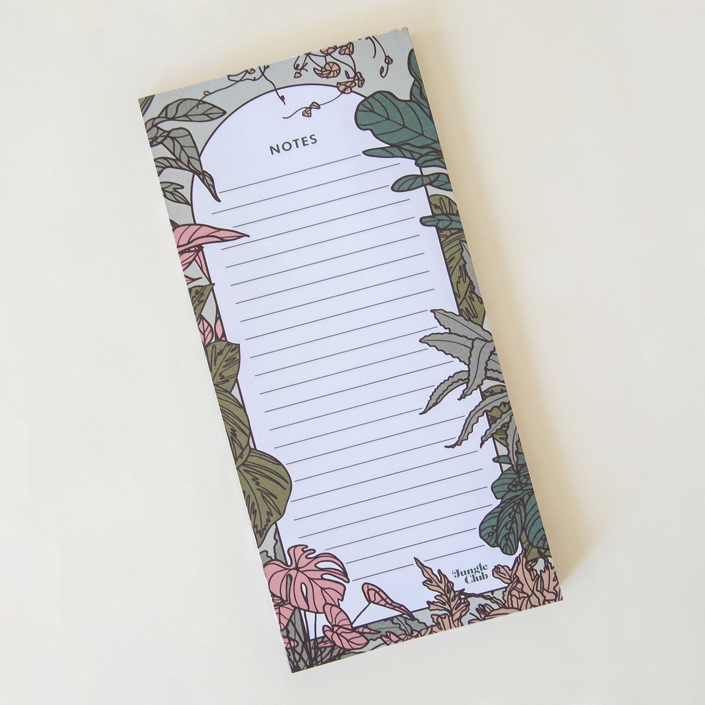 This rectangular notepad is filled with horizontal lines and outlined in a deep green border, accented by an array of natural, soft toned jungle plants.