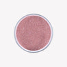 On a white background is a bowl of brick colored terrarium sand. 